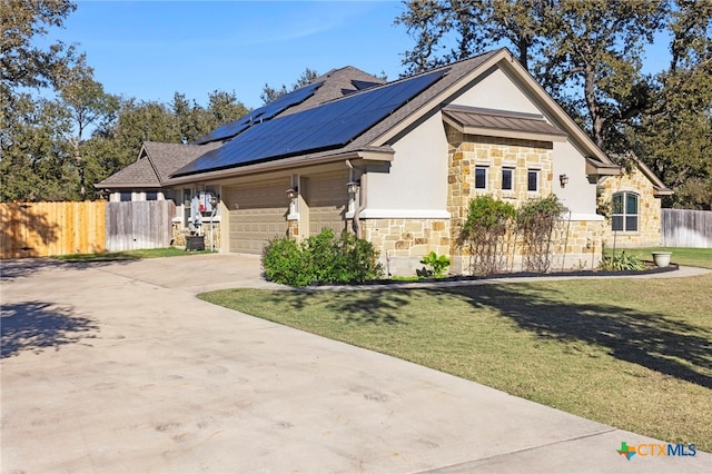 view of property exterior with solar panels, a garage, and a lawn