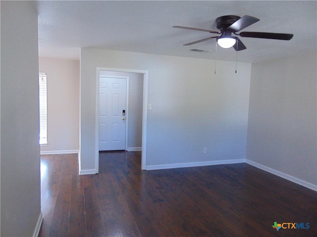 unfurnished room featuring ceiling fan and dark hardwood / wood-style floors