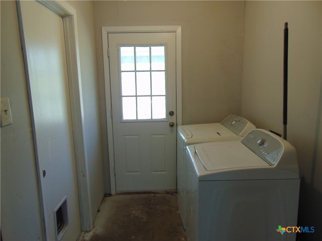 laundry room with washing machine and clothes dryer