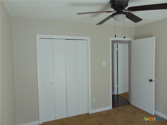 unfurnished bedroom featuring carpet flooring, ceiling fan, and a closet