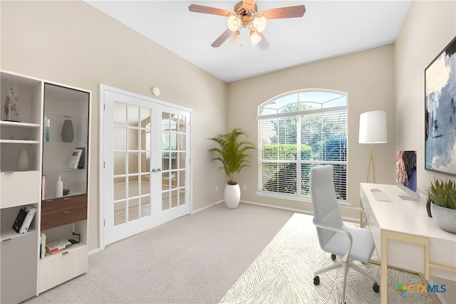 home office with french doors, light carpet, and ceiling fan