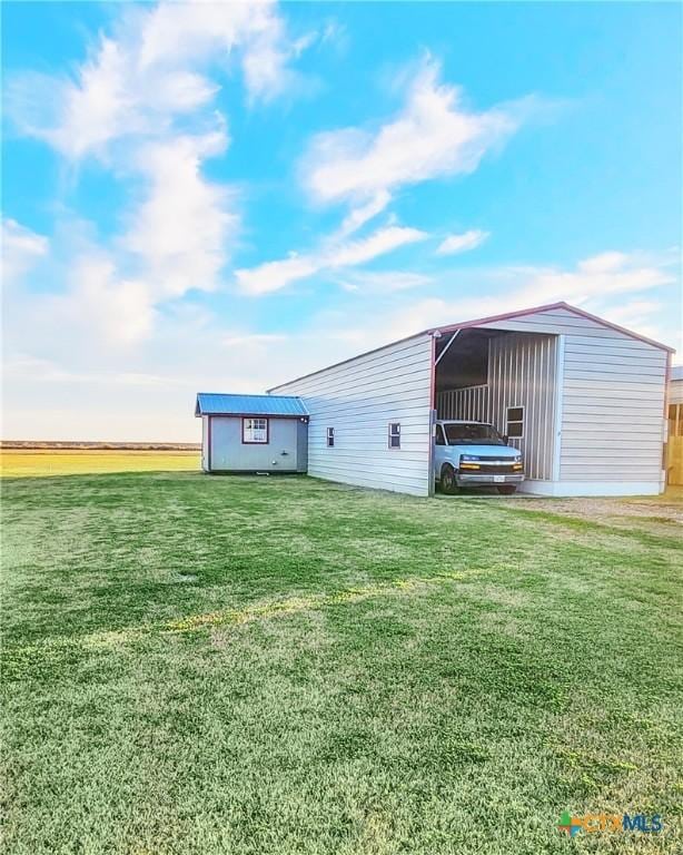 exterior space with a yard and a storage unit