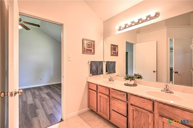5202 J I Bruce Dr, Temple, TX 76502 - full bathroom featuring vaulted ceiling, double vanity, ceiling fan, baseboards, and wood finished floors