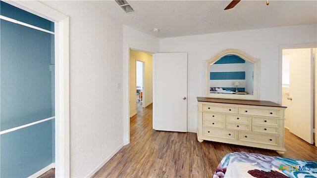 bedroom featuring hardwood / wood-style floors and ceiling fan