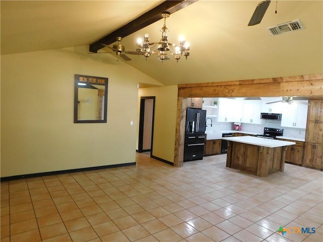 1102 Crockett, Cotulla, TX 78014 - kitchen with ceiling fan, black appliances, light countertops, light tile patterned flooring, and a chandelier