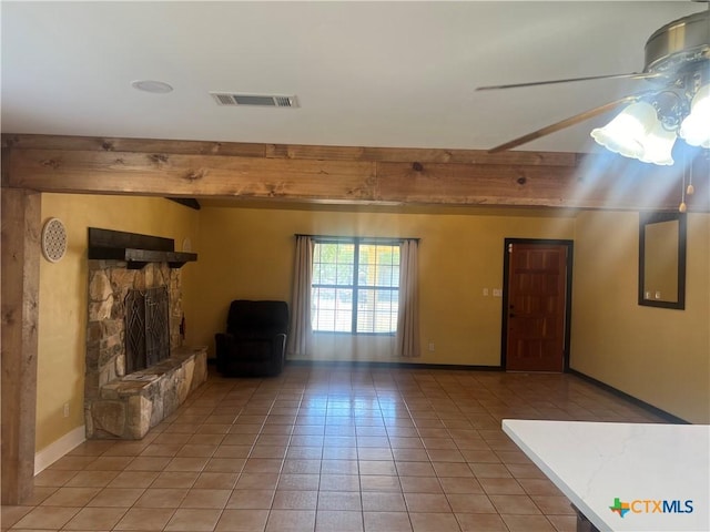 1102 Crockett, Cotulla, TX 78014 - unfurnished living room featuring light tile patterned floors, a fireplace, baseboards, and beamed ceiling
