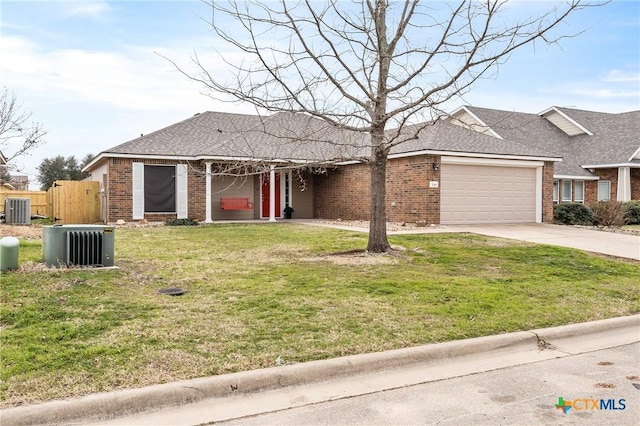 ranch-style house with a garage, driveway, central air condition unit, a front lawn, and brick siding