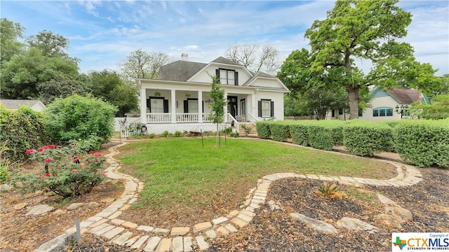 view of front of property with a front lawn and covered porch