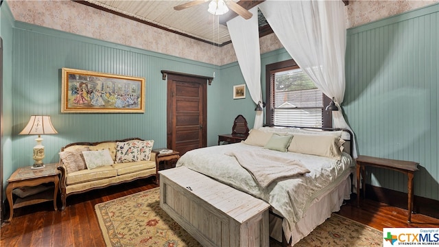 bedroom featuring dark hardwood / wood-style flooring and ceiling fan