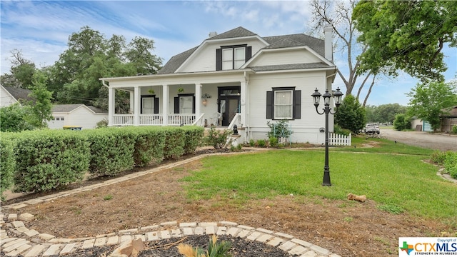 view of front of house featuring a porch and a front lawn