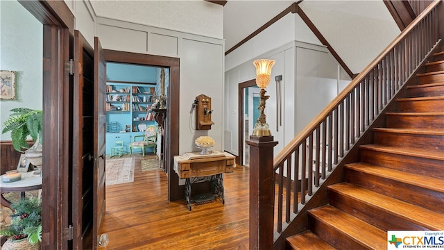 foyer entrance with hardwood / wood-style flooring