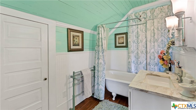 bathroom featuring vanity, wood ceiling, hardwood / wood-style flooring, lofted ceiling, and shower / bath combo with shower curtain