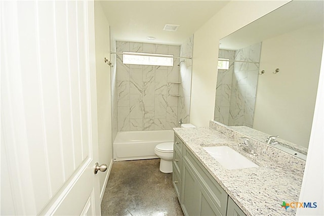 full bathroom with vanity, tiled shower / bath combo, and toilet