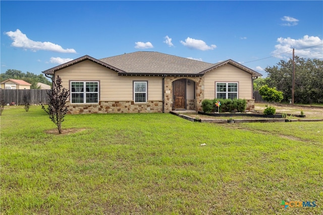 single story home with a front lawn