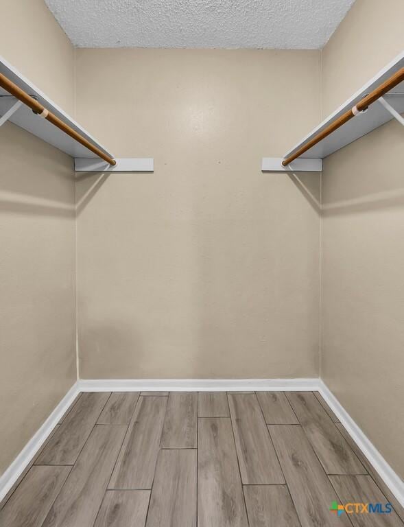 1117 Lindsey Cir, Belton, TX 76513 - spacious closet with wood tiled floor