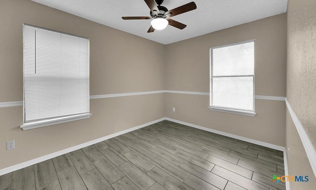 1117 Lindsey Cir, Belton, TX 76513 - empty room featuring wood tiled floor, baseboards, and a ceiling fan