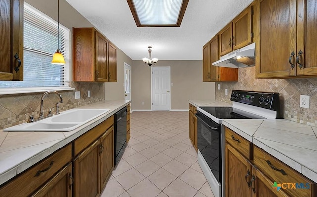 1117 Lindsey Cir, Belton, TX 76513 - kitchen featuring a sink, a chandelier, dishwasher, under cabinet range hood, and electric stove