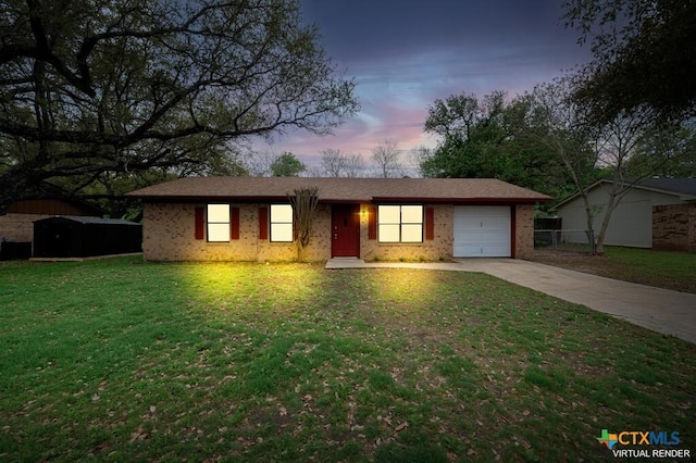 1117 Lindsey Cir, Belton, TX 76513 - ranch-style house with brick siding, a garage, a front lawn, and concrete driveway