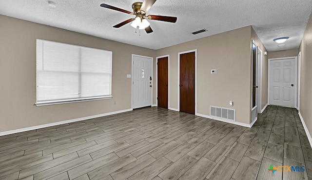 1117 Lindsey Cir, Belton, TX 76513 - interior space with baseboards, visible vents, wood finished floors, and ceiling fan