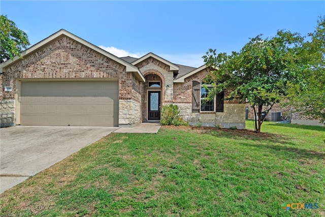 ranch-style home with a garage, a front lawn, and central AC