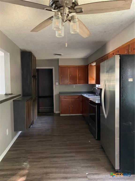 701 S 19th St, Copperas Cove, TX 76522 - kitchen featuring stainless steel fridge with ice dispenser, ceiling fan, stove, dark countertops, and dark wood finished floors