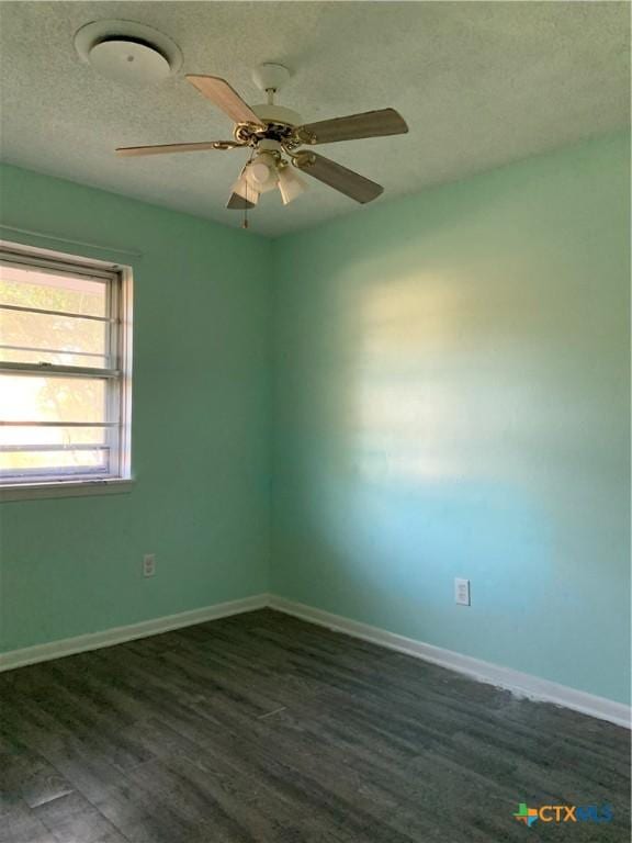 701 S 19th St, Copperas Cove, TX 76522 - spare room with dark wood-style floors, a textured ceiling, and ceiling fan
