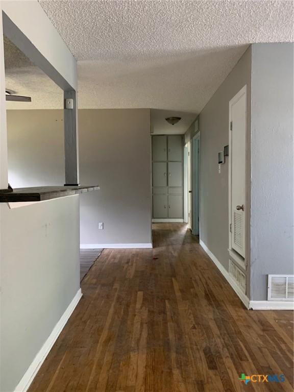 701 S 19th St, Copperas Cove, TX 76522 - corridor with a textured ceiling and wood finished floors