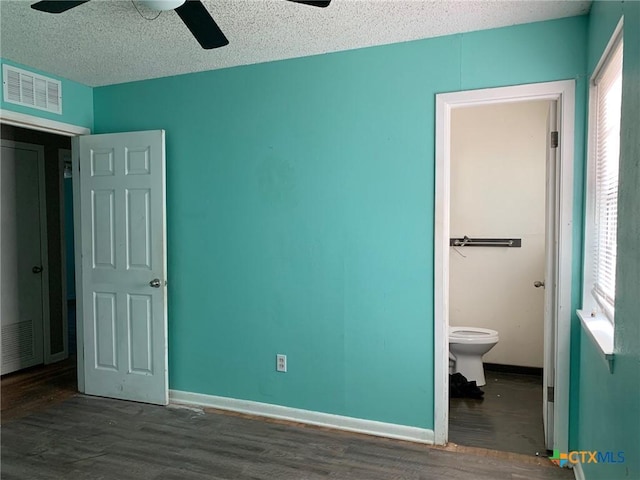 701 S 19th St, Copperas Cove, TX 76522 - unfurnished bedroom with wood finished floors, ceiling fan, a textured ceiling, and ensuite bath