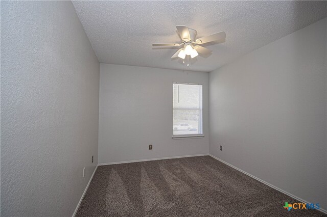 empty room featuring ceiling fan, carpet floors, and a textured ceiling