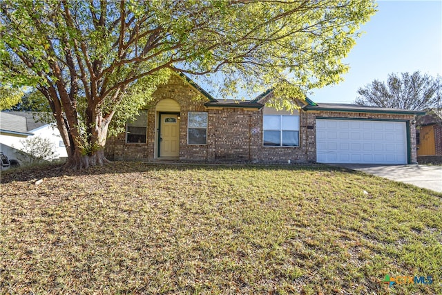 ranch-style home with a front yard and a garage