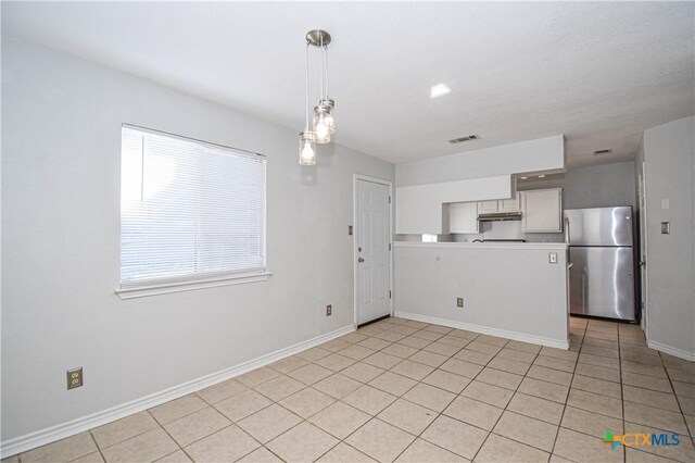 dining space featuring light tile patterned floors