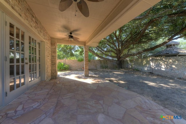 view of patio with ceiling fan and french doors