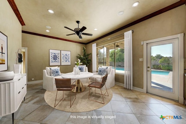 dining room featuring crown molding and ceiling fan