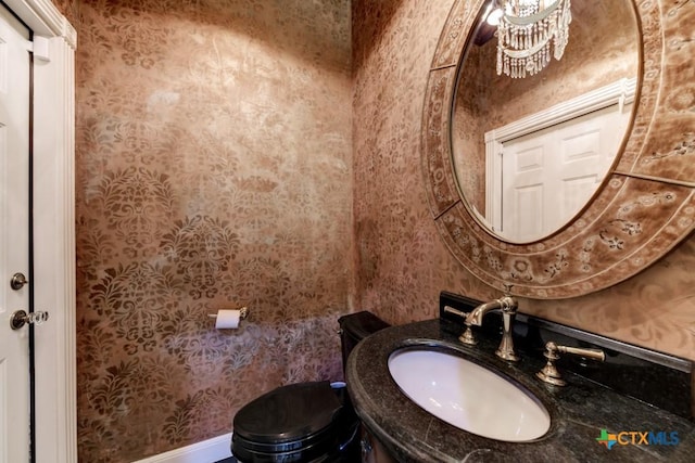 bathroom featuring sink and toilet