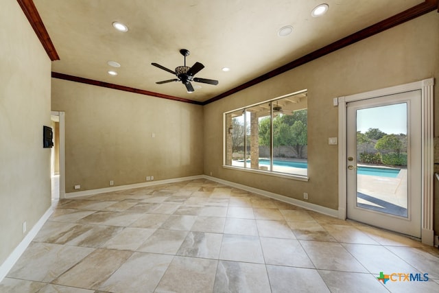 unfurnished room with ceiling fan and ornamental molding