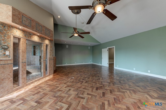 unfurnished living room with parquet floors and high vaulted ceiling