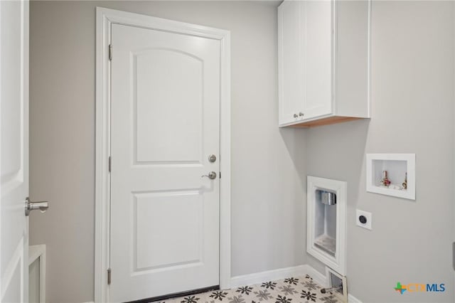 clothes washing area with cabinets, hookup for a washing machine, and hookup for an electric dryer