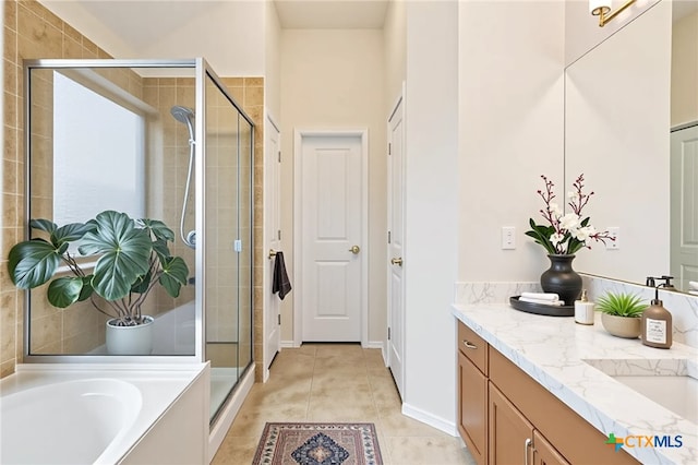 4004 Brookhaven Dr, Temple, TX 76504 - full bath featuring vanity, a stall shower, a garden tub, and tile patterned flooring
