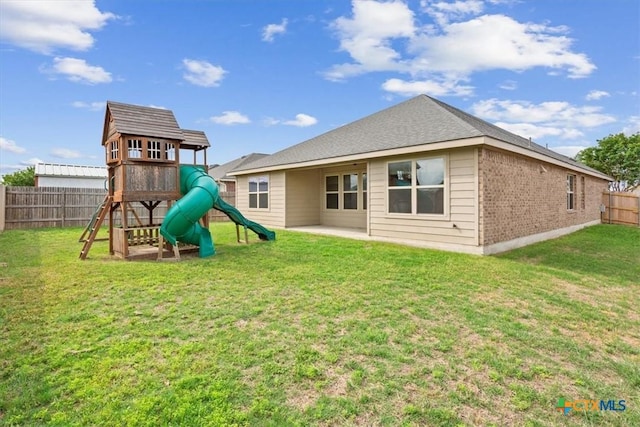 4004 Brookhaven Dr, Temple, TX 76504 - back of house with a playground, brick siding, and a patio