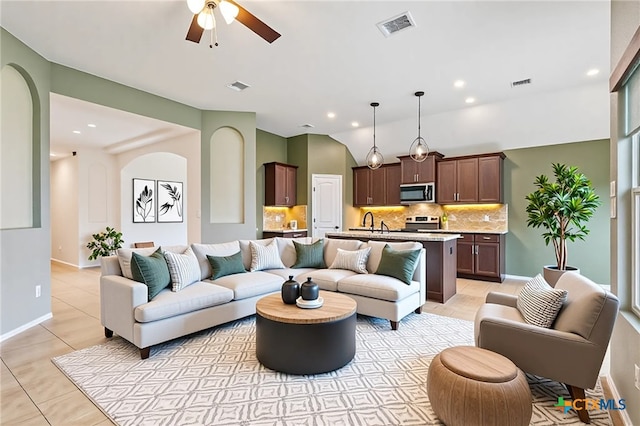 4004 Brookhaven Dr, Temple, TX 76504 - living area featuring ceiling fan, light tile patterned floors, recessed lighting, and arched walkways