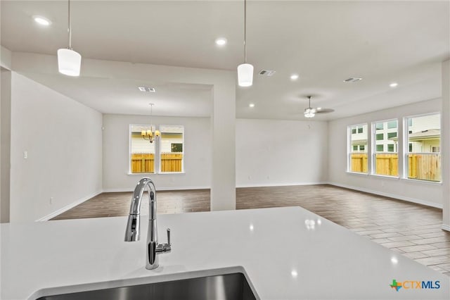 812 Waylon Cir, Killeen, TX 76542 - kitchen with recessed lighting, open floor plan, decorative light fixtures, ceiling fan, and light countertops