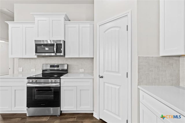 812 Waylon Cir, Killeen, TX 76542 - kitchen featuring stainless steel appliances, white cabinetry, and light countertops