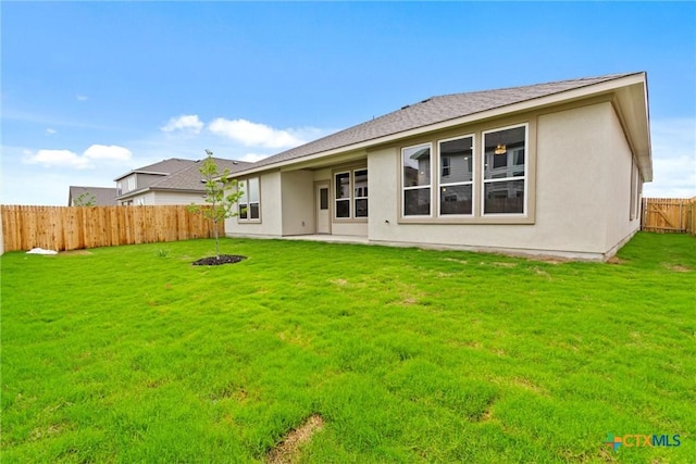 812 Waylon Cir, Killeen, TX 76542 - back of house featuring a fenced backyard, stucco siding, and roof with shingles