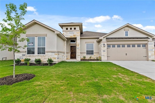 812 Waylon Cir, Killeen, TX 76542 - view of front of property with stone siding, stucco siding, driveway, a front yard, and an attached garage