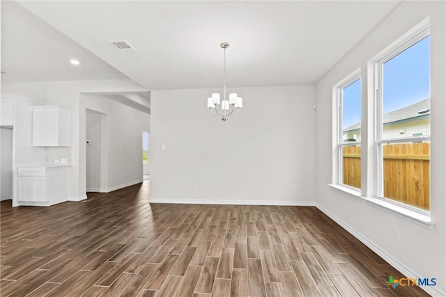 812 Waylon Cir, Killeen, TX 76542 - unfurnished dining area with a chandelier and dark wood-type flooring