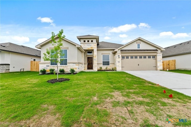 812 Waylon Cir, Killeen, TX 76542 - view of front of home featuring stone siding, driveway, a garage, and stucco siding