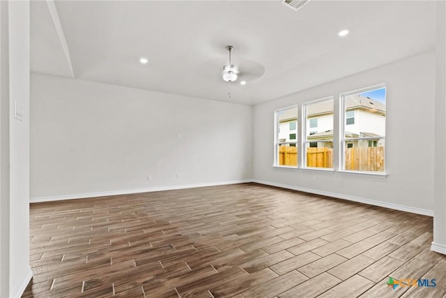 812 Waylon Cir, Killeen, TX 76542 - spare room featuring ceiling fan, wood finished floors, and recessed lighting