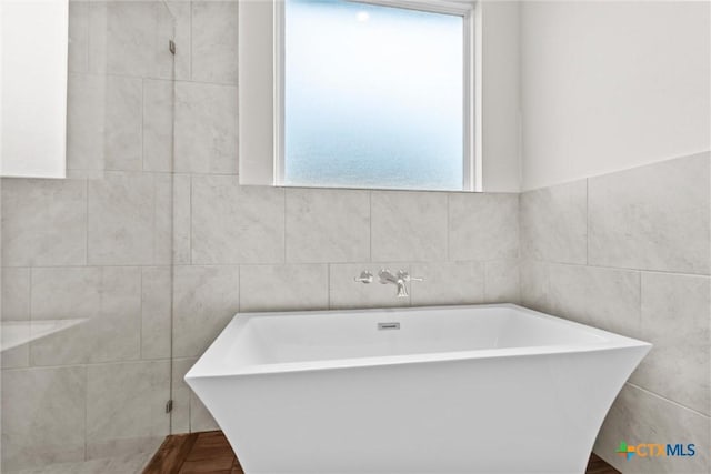 812 Waylon Cir, Killeen, TX 76542 - full bath with a freestanding tub and tile walls