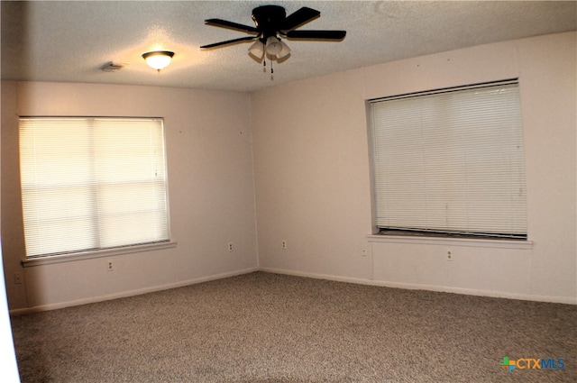 spare room with carpet floors, a textured ceiling, and ceiling fan