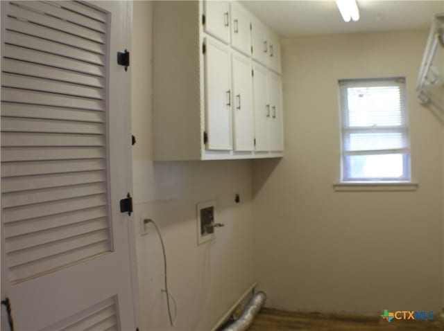 clothes washing area featuring cabinets, electric dryer hookup, and hookup for a washing machine